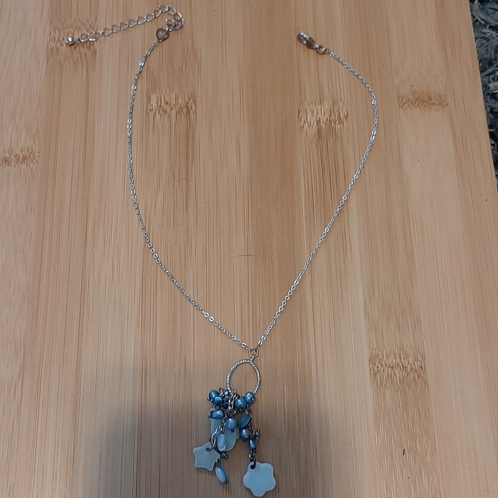 Blue charmed drop necklace